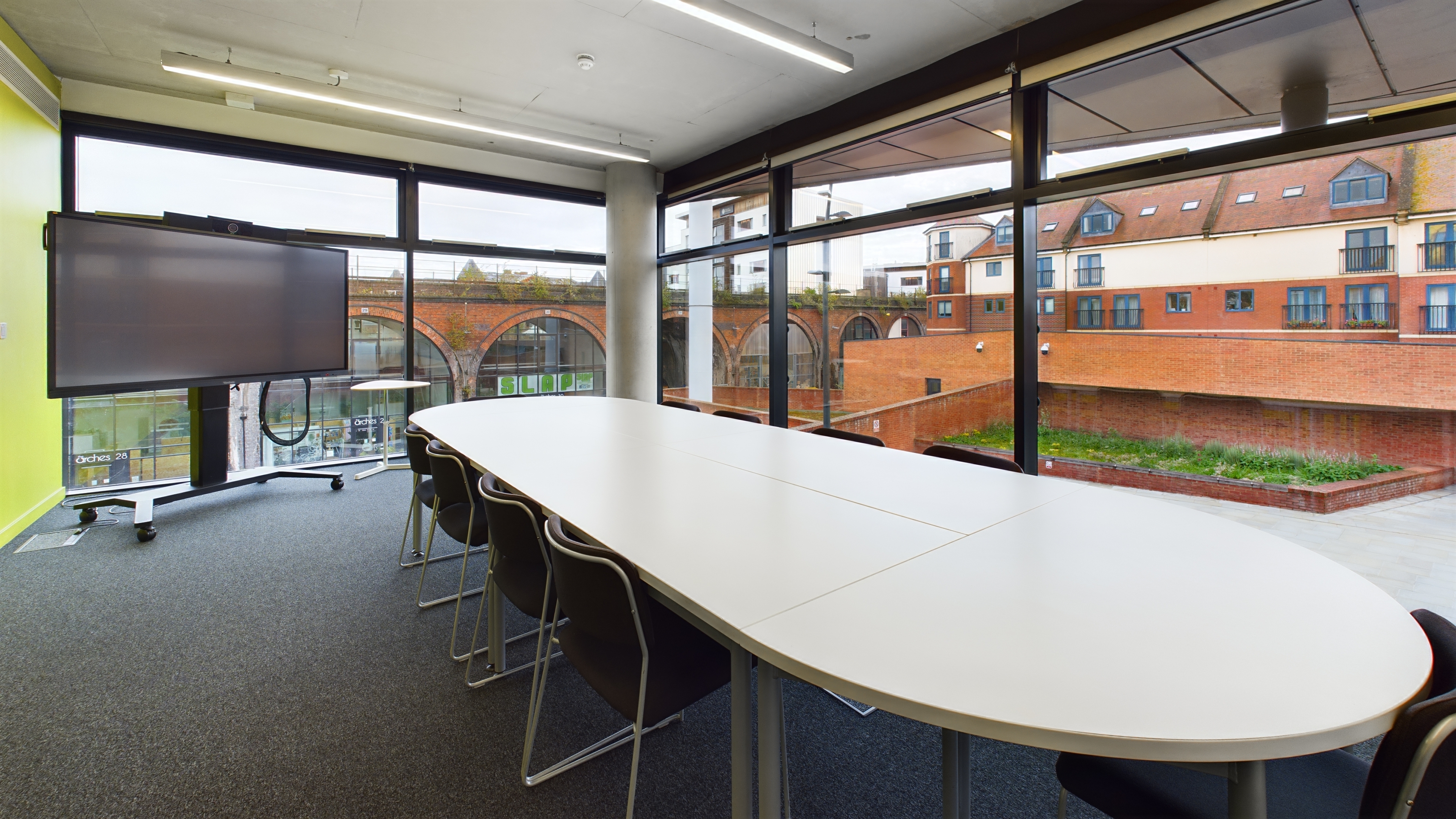 Meeting room 4 in The Hive, with large screen equipment for online meetings