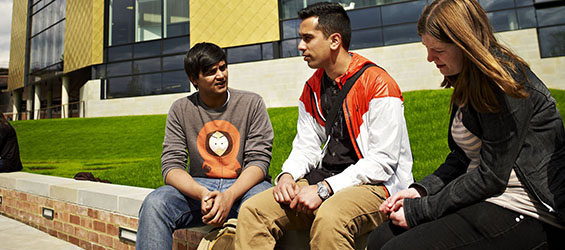 Young people sitting outside the Hive